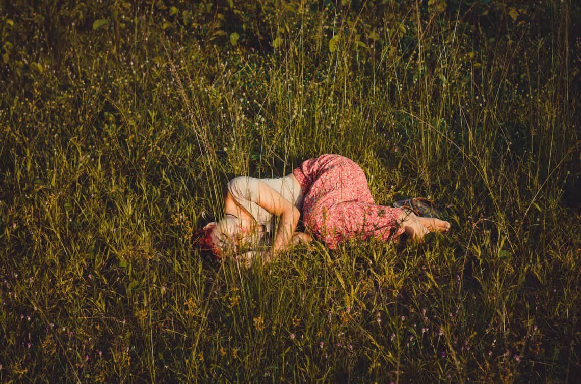 Person laying in the grass