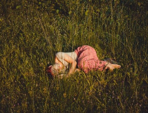 Person laying in the grass