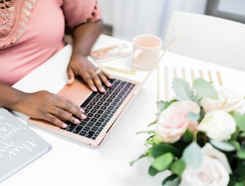 A lady working on her blog on her laptop